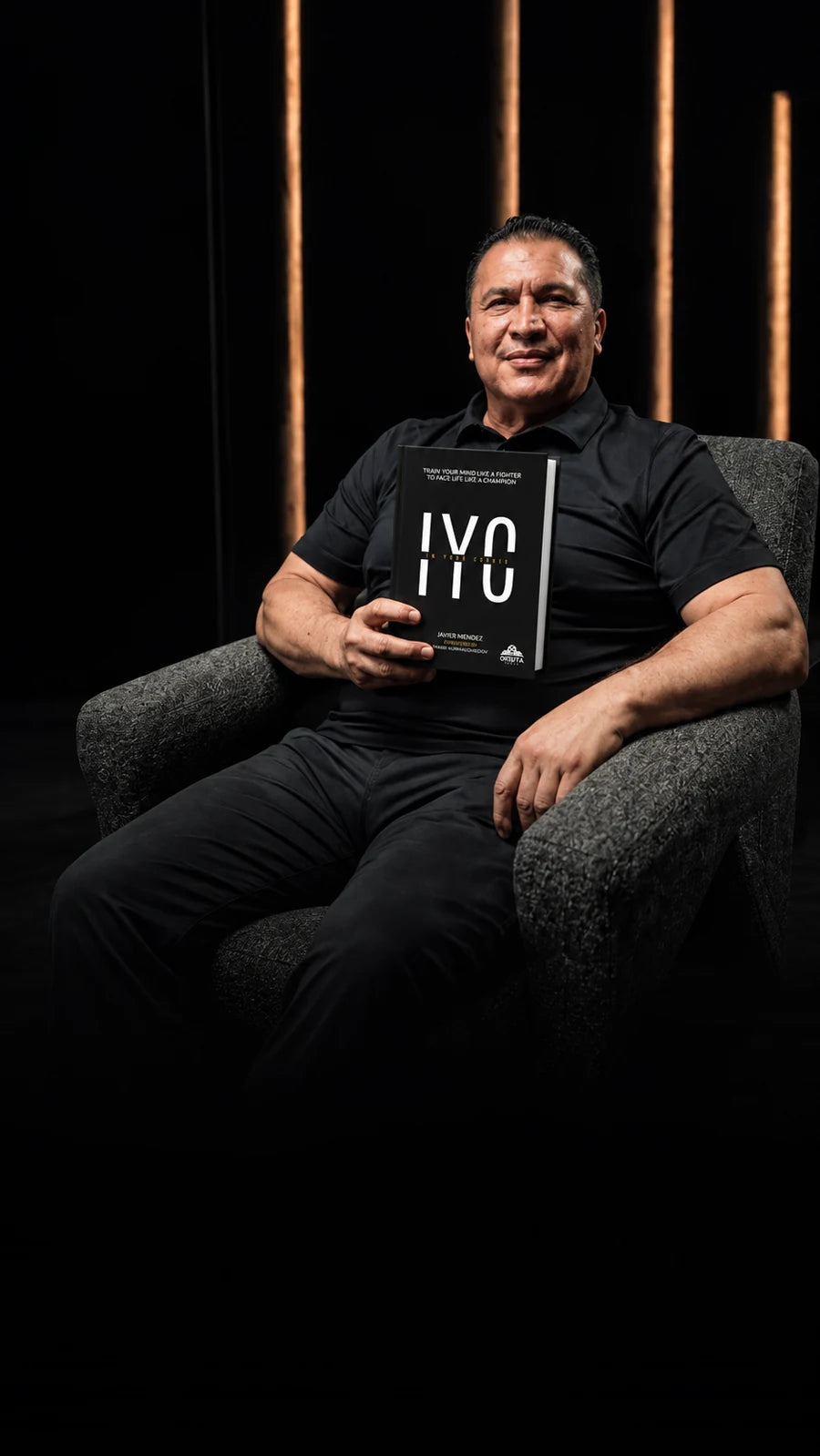 Javier Mendez with the In Your Corner hardcover