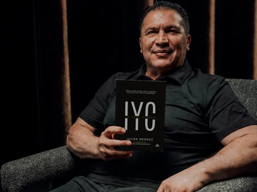 Javier Mendez with the In Your Corner hardcover